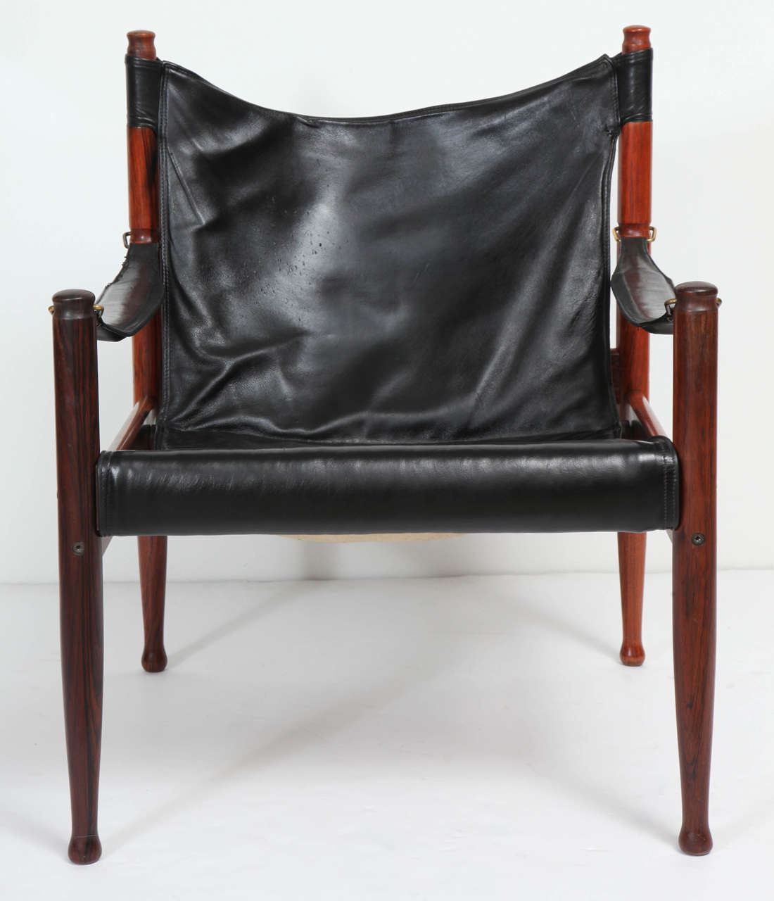 Safari chair by Erik Worts for N. Eilersen, Denmark, 1960s. Brazilian rosewood frame with brass detail and original black leather upholstery.