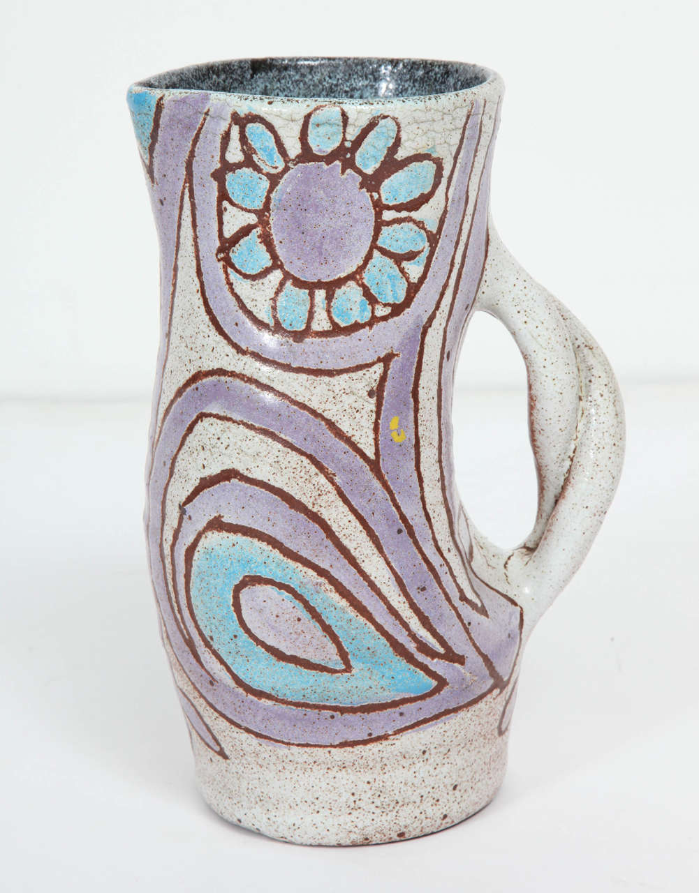 Pottery pitcher by Accolay.  Signed.  France, circa 1950.  Features a floral, swirl pattern in grey, blue and violet.