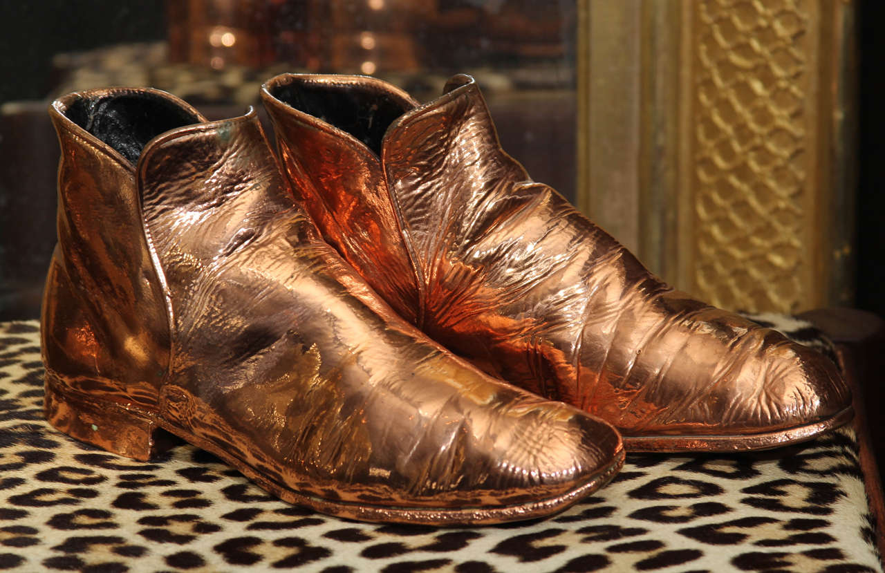 Copper-plated vintage men's boots.