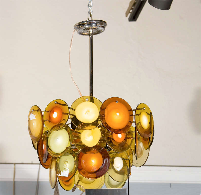 A Pair of Art Deco style fixture with beautiful retro orange glass disc with chrome center rod. Can purchase one.