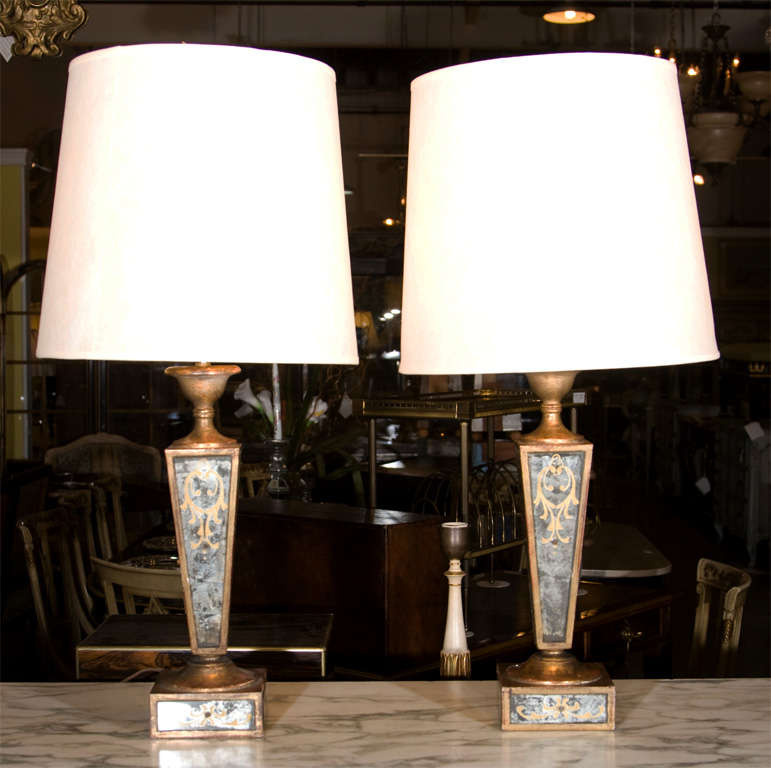 Pair of very chic eglomise mirrored lamps with gilt accents stamped Jansen.