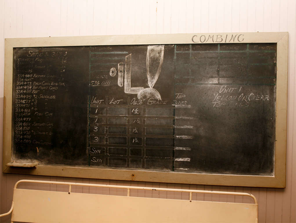 large wood framed slate blackboard<br />
with side tray for chalk<br />
from a weaving factory<br />
still retains info featuring Oil !