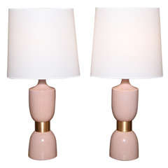 Pair of pink crackle glazed ceramic lamps with brass detailing