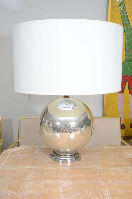 Oversized perfect orb with signs of antiquing to glass which adds to its vintage beauty.