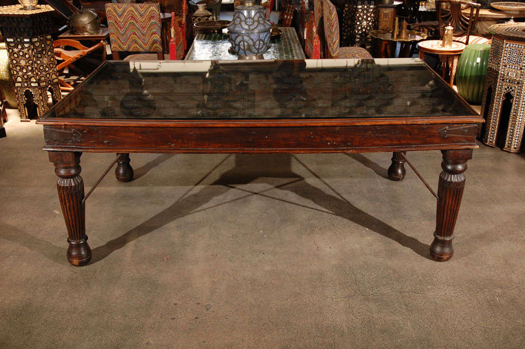 Fabulous antique architectural carved wooden double doors made into a dining Table.
Solid teak wood Dining Table or could be used also as a Desk.
Metal accents support the very nicely carved legs and the corners are reinforced with metal