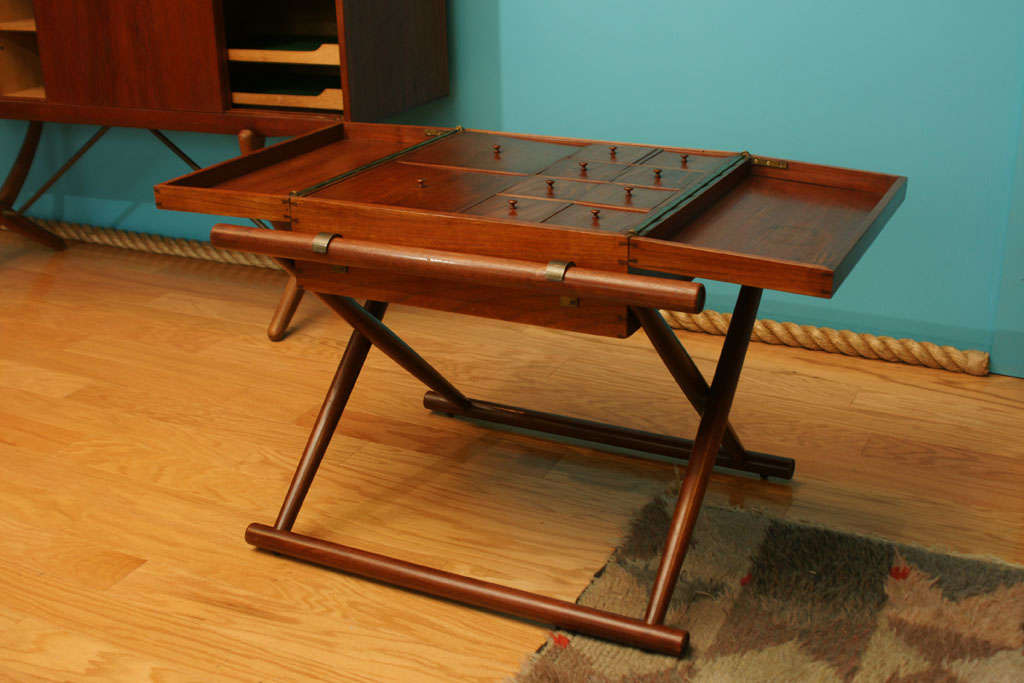 Hinged Teak Display Cabinet with Interior sections protected by knobbed lids.  Folding Teak Frame receives the Cabinet.