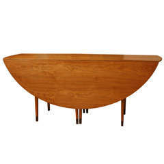 Retro Walnut Oval Drop-Leaf Table by Edward Wormley