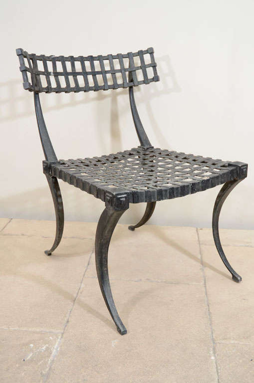 A mid 20th century American metal neoclassical klismos form side chair with faux bronze finish