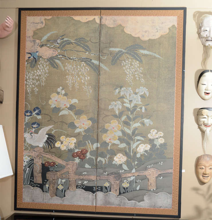 A colorful two panel Japanese painted screen with flower and bird motif. The style has been attributed to the Rumpa School of screen paintings.