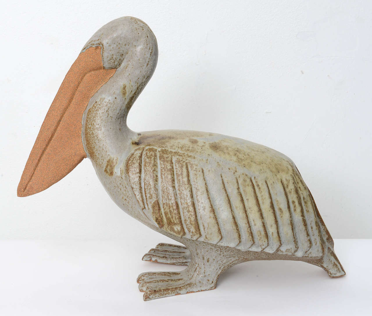 Artisan signed ceramic pelican.

Please feel free to contact us directly for a shipping quote or any additional information by clicking 