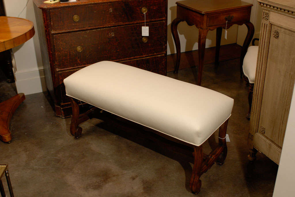 French bench with nice stretcher and new muslin upholstery.