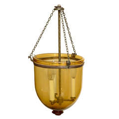 Amber colored small bell jar, electrified