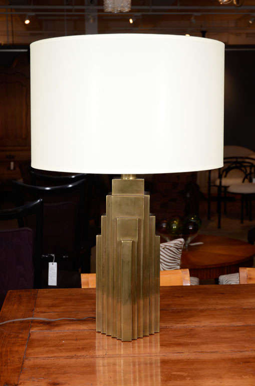 A pair of striking brass skyscraper lamps, made by Chapman, for the Bullocks Department Store in Beverly Hills.