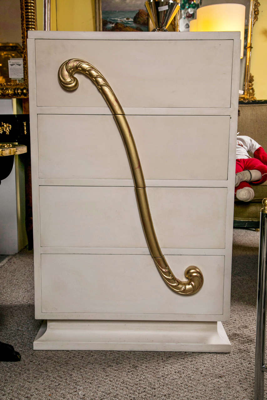 Hollywood Regency style white painted dresser, circa 1970s, quirky design, consists a total of four drawers, decorated with raised parcel-gilt scroll motif on the surface, raised on block base. By Maison Jansen.