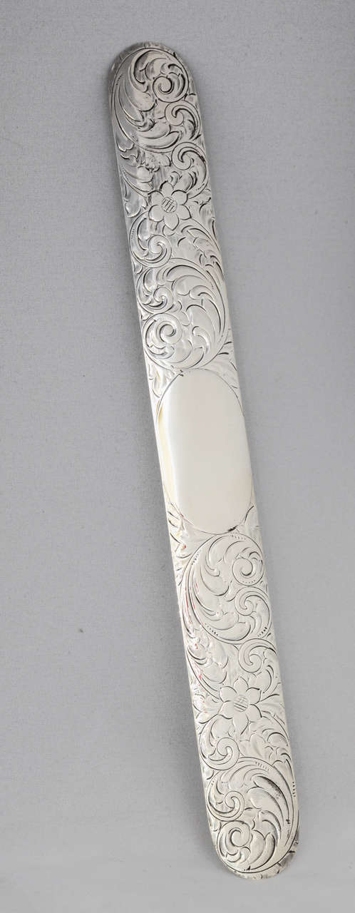 Victorian, sterling silver page turner, American, circa 1895. Beautifully etched; vacant cartouche; 10