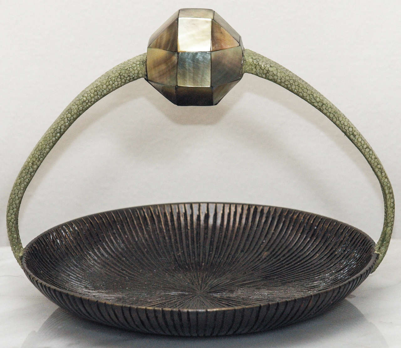 Elegant textured bronze vessel by R&Y Augousti Paris, so marked; up curving handles covered in shagreen; faceted 