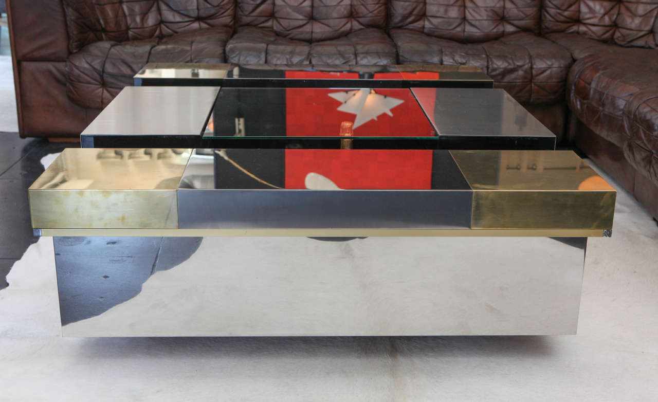 Amazing and very unique brass and chrome rubrics cube coffee table by Gabriella Crispi..  The top slides open for bar or display.