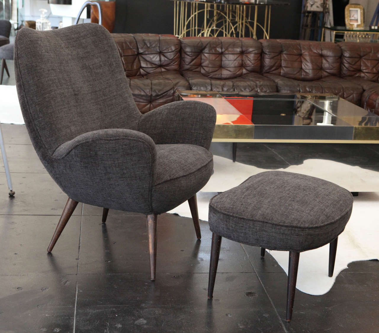 Beautiful and comfortable Italian 1950s Pair of Armchairs by Silvio Carvatorta with Matching Ottomans.