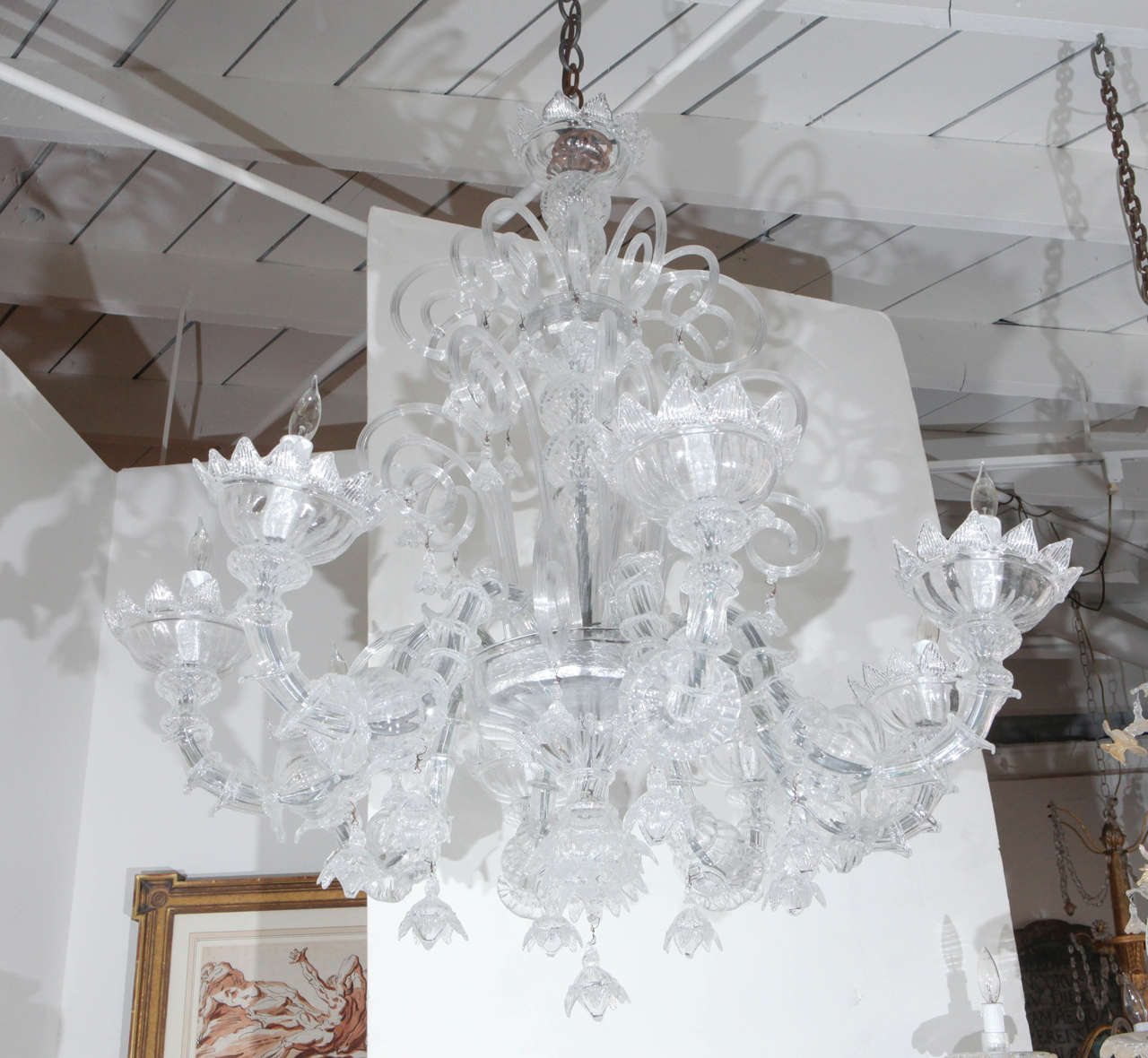 Lush, handblown, eight light, Murano glass chandelier with floral details.