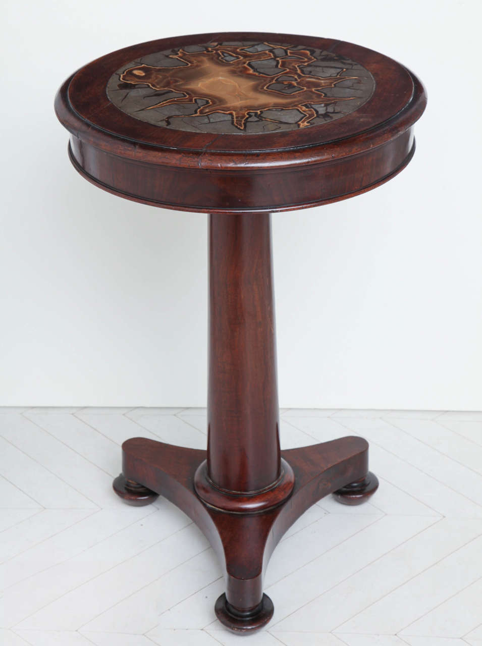 An unusual late Regency (Wiliam IV) mahogany side table with inset septarian concretion top, circa 1830