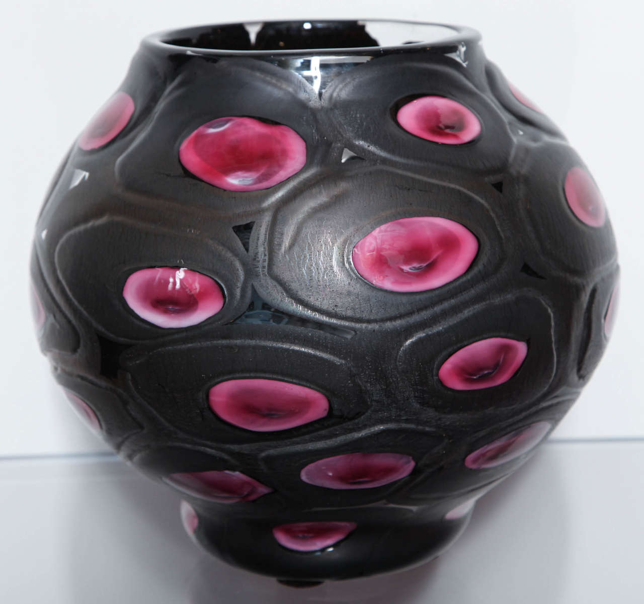 Gorgeous, and large bulbous shaped vase of clear glass with gunmetal overlay, and large fuschia murrines.  Very unusual technique and form.