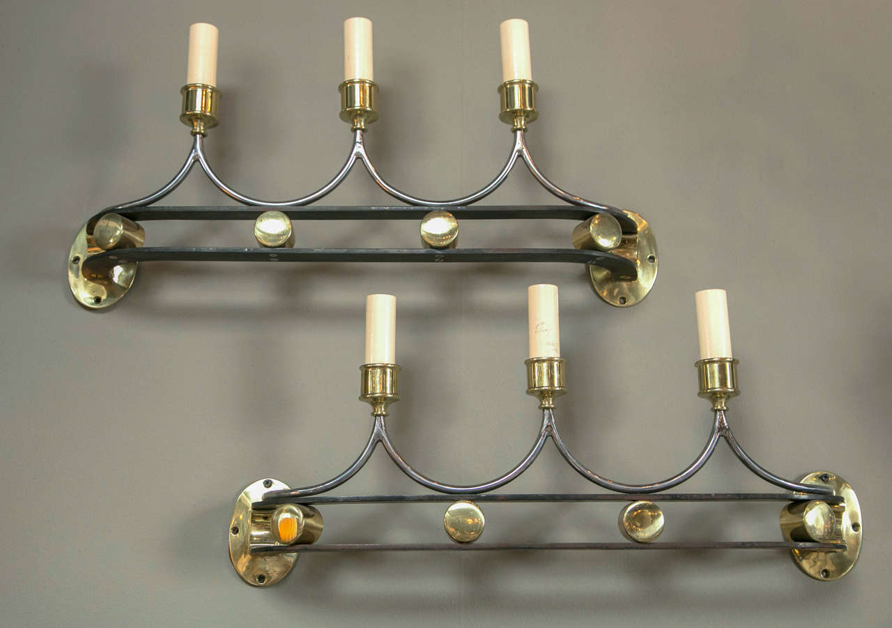 A wonderful pair of brass and iron art deco sconces. circa 1930.