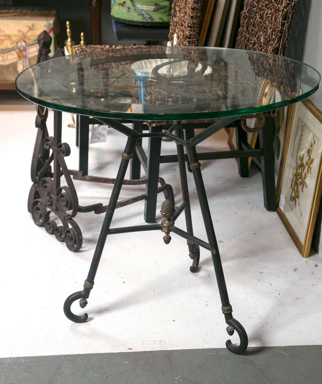 A great glass top iron table, circa 1950s.