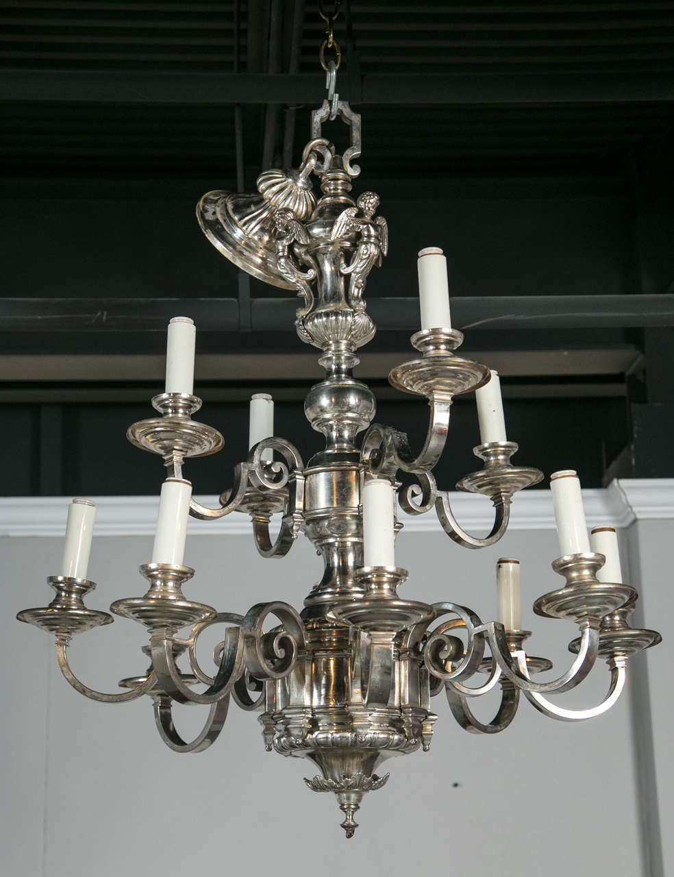 An amazing pair of twelve-light Caldwell chandeliers, circa 1900s. Original silver plated finish.