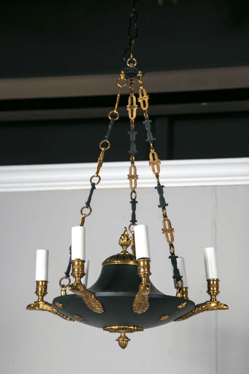A fabulous eight-light French Empire chandelier, with eagle heads.