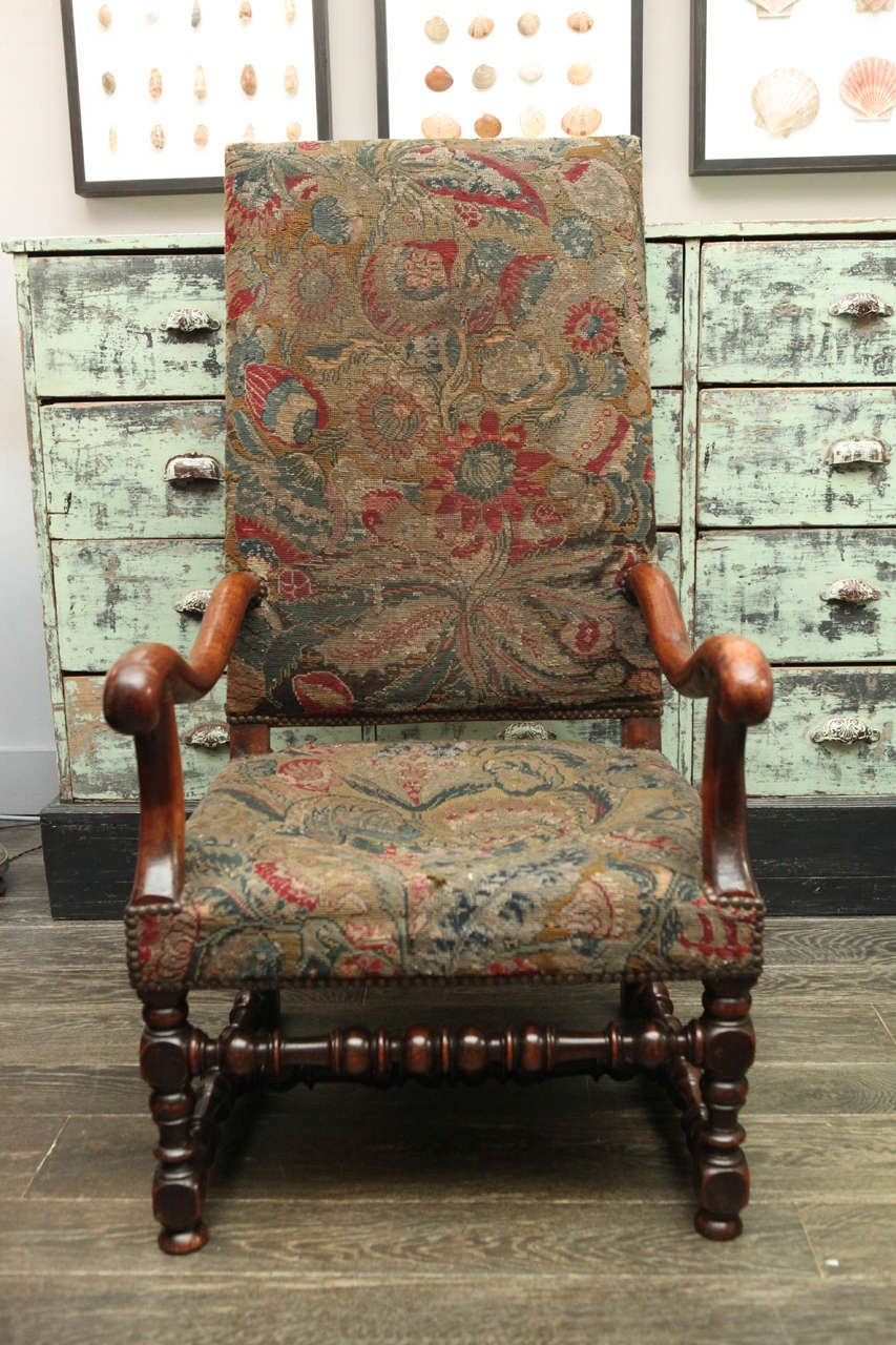 An 18th century armchair with tapestry.