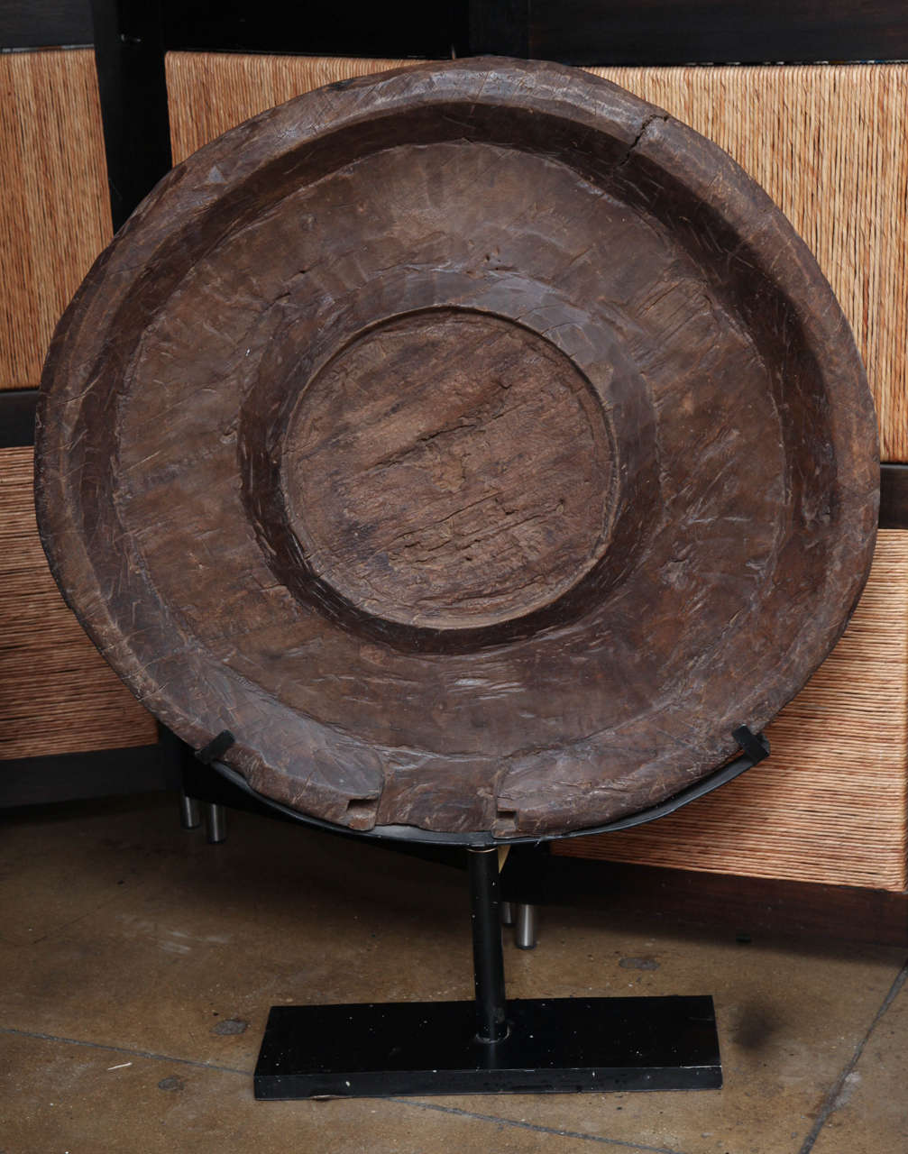 A Madura food tray sculpture from Indonesia, on a stand.