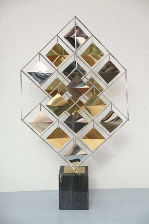 Unusual and rare brass and chrome cube sculpture on black marble base. Signed C. Jere '85.