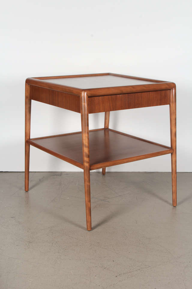 Medium walnut airy side tables with hidden plinth drawers. By T. H. Robsjohn-Gibbings for Widdicomb, dated 1953. Newly refinished.

These items can be seen at the 1stDibs@NYDC Showroom, 200 Lexington Avenue, Tenth Floor