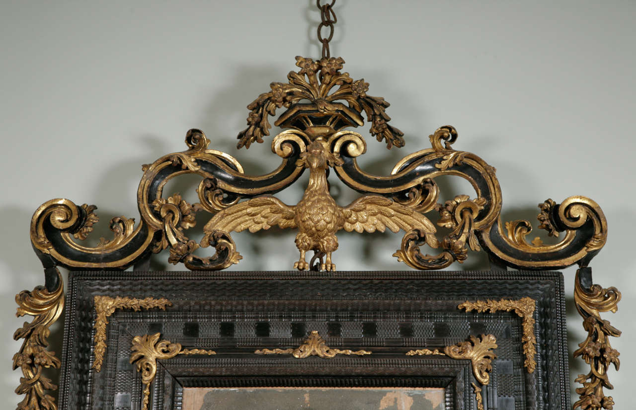 An Early 18th Century Venetian Ebonised & Parcel Gilt Mirror. 1