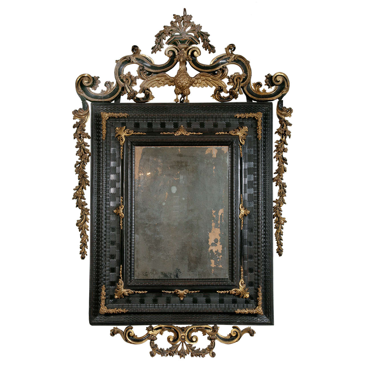 An Early 18th Century Venetian Ebonised & Parcel Gilt Mirror.