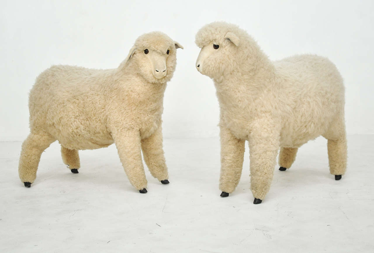Decorative pair of Lalanne style sheep.  Vintage life size sheep covered in sheepskin.