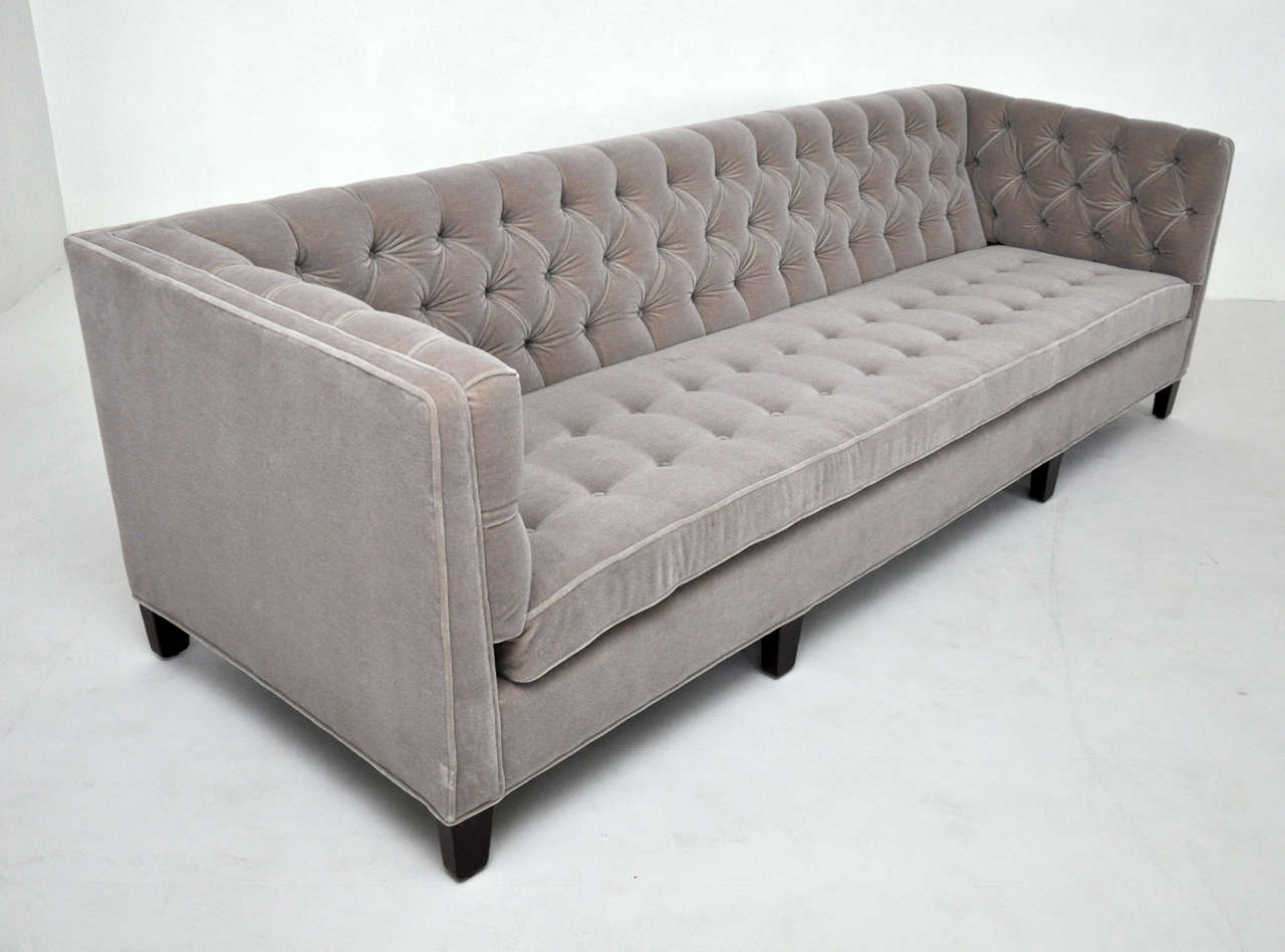 Tuxedo sofa by Edward Wormley for Dunbar. Tufted back and side arms. All natural Belgian mohair over dark mahogany legs.