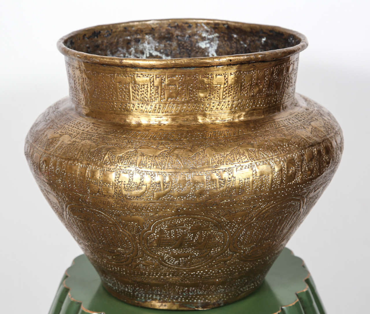 19th century large Jewish Egyptian finely hand etched brass memorial bowl decorated with medallions with Hebrew inscriptions, pyramids, sphinx, and human figures; the motifs are from the period of slavery in Egypt.
Could be used as a