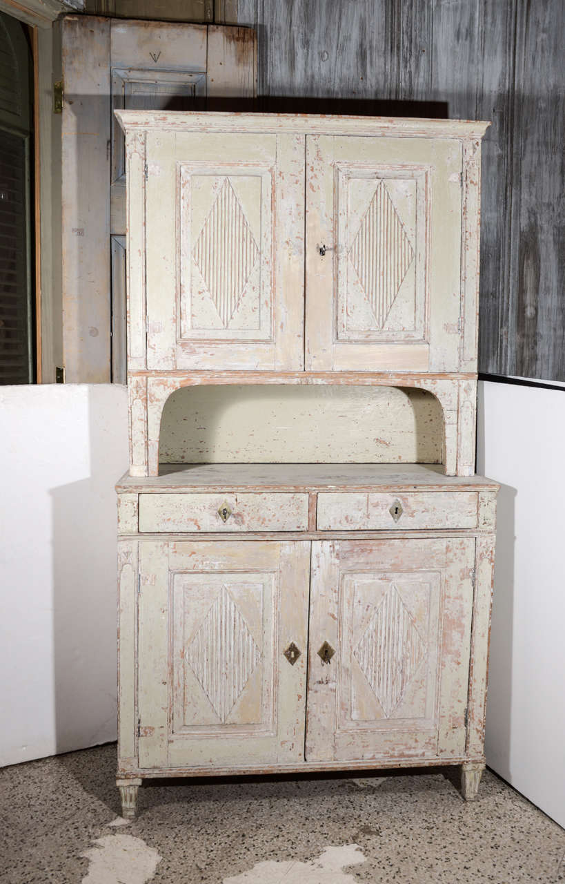 Early 19th century Swedish cupboard with reeded diamond pattern on the doors. Scraped painted finish.