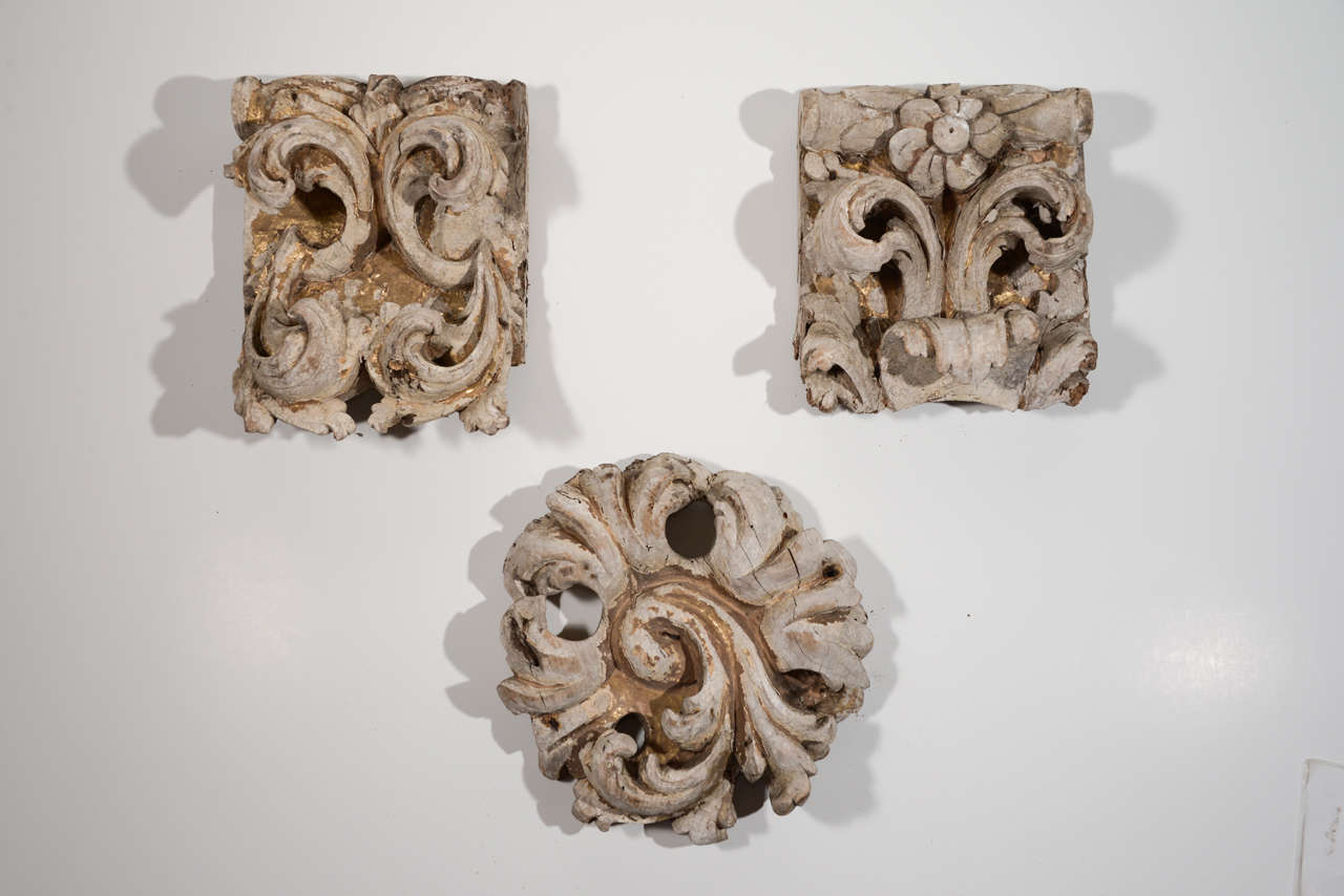 Five carved architectural fragments with traces of gilding.
Dimensions, round piece is 12