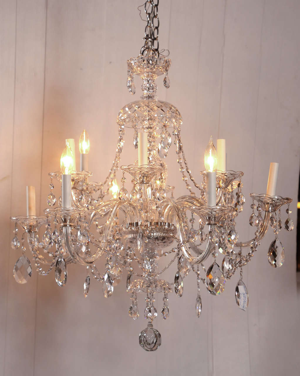 Fine Cut Crystal Chandelier Twelve Arm. This fine Austrian Cut Crystal Chandelier having a central column cut crystal support with a cut crystal canopy and several tiers leading to a group of six arms on two separate tiers giving a total of twelve