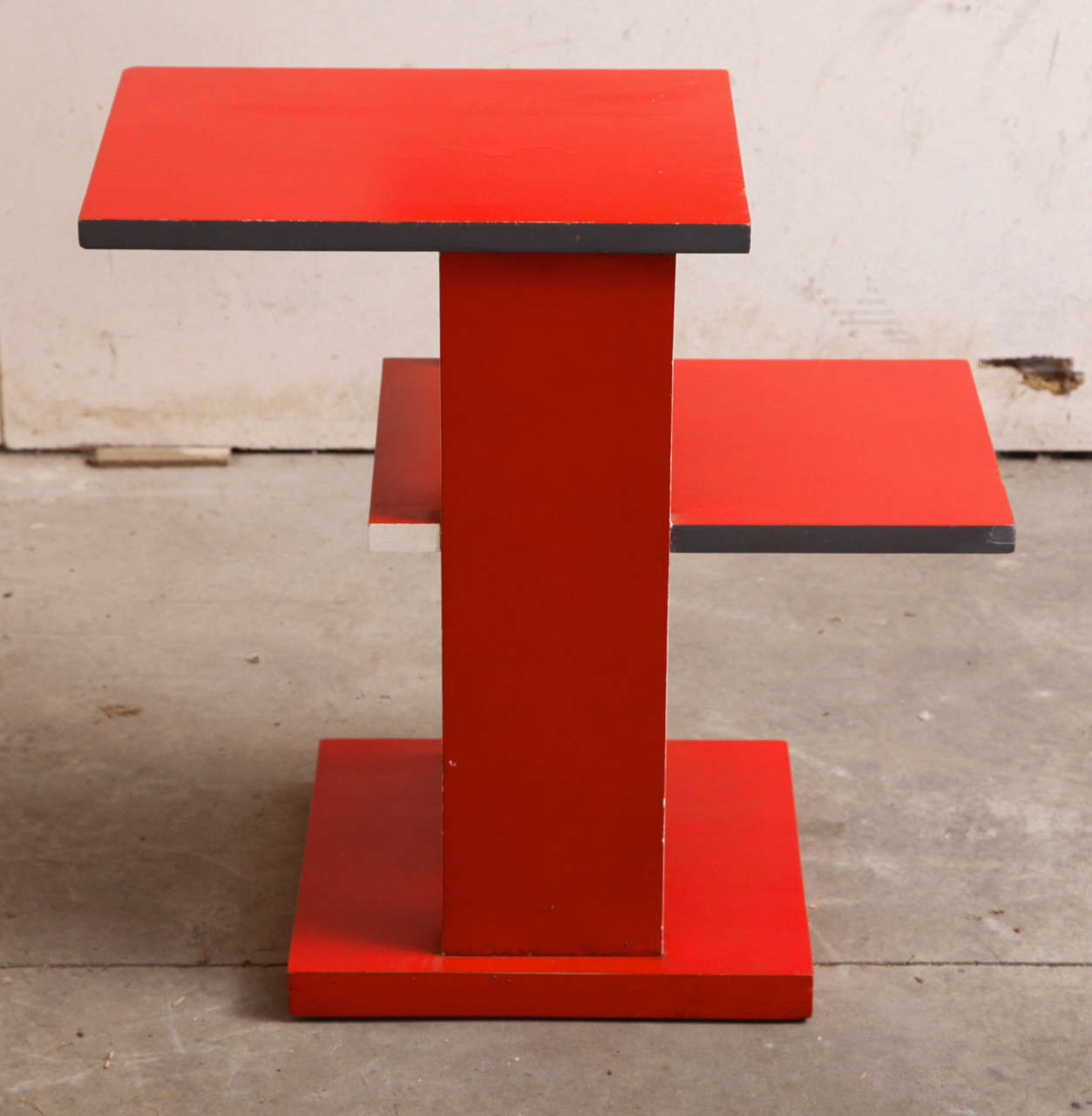 a rietveld style occasional table, red lacquer