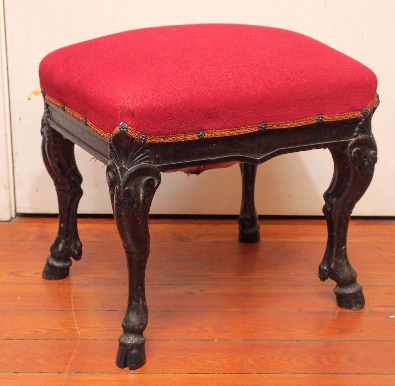 Pair of 19th c. Italian Walnut Footstools with hoof feet and upholstered tops