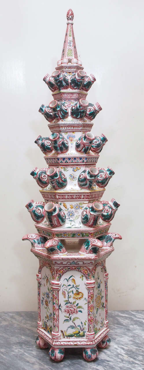 19th century continental faience tin-glazed monumental pagoda form tulipiere with fish head and eagle head forms.