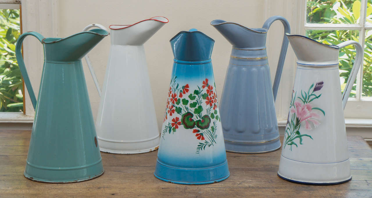 This is an English collection of pitchers, some solid color and some floral design and all are the same height and vary in price between $150-$175. They make a beautiful display in any room in your home and some can hold water for flowers. Each has
