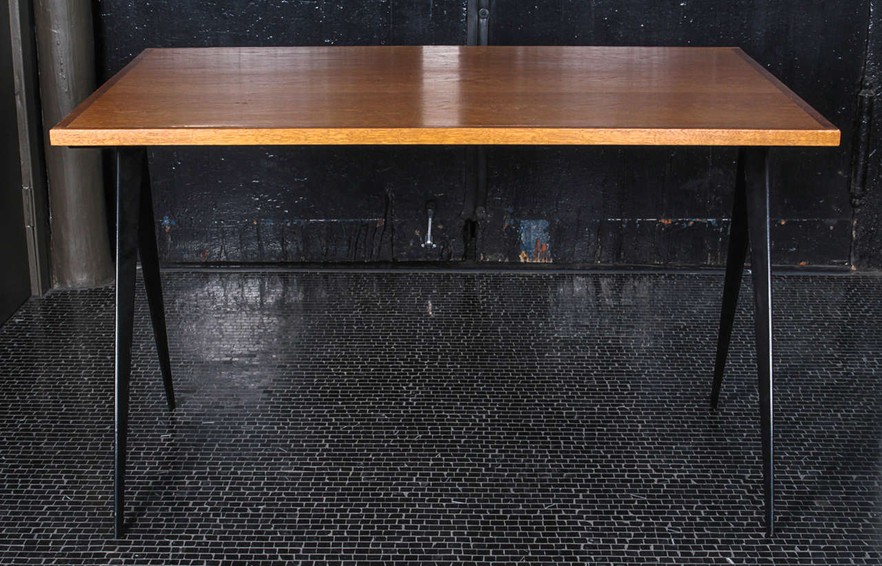 Jean Prouve desk, French, 1950s. Oak and black-painted iron frame.
