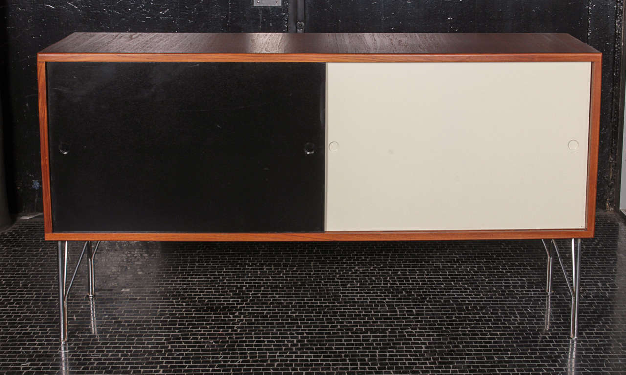 Heinrich Roepstorff Danish credenza with teak case, Masonite doors, and chrome legs.