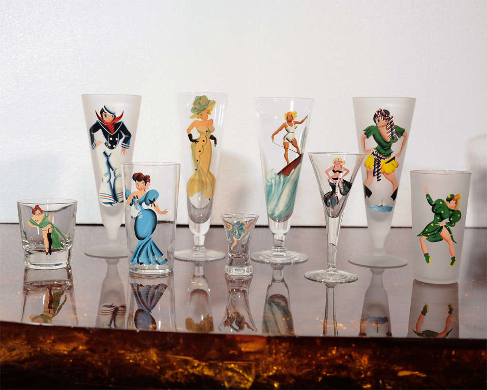 A set of custom-made, hand-painted drinking glasses from the Estate of Doris Duke. The front of the glasses are painted with clothed female figures. From the inside of the glass, the woman is nude(see images). There are 10 large cocktail glasses (8