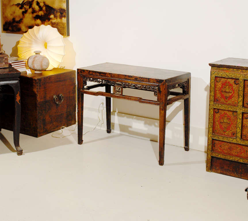 This carved altar table has a Taoist influence as well as a Sacred Stag pierced-carving on the center of the long sides of the table.  The cranes pierce-cut and centered on the shorter sides have many symbolic meanings, which include longevity and