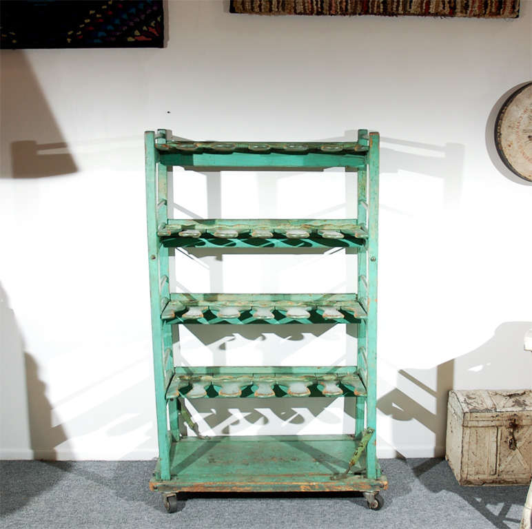 RARE AND UNUSUAL ORIGINAL PAINTED EARLY 20THC SHOE TREE/RACK FROM PENNSYLVANIA.THESE RACKS ARE INDUSTRIAL AND ARE FROM THE OLD SHOE FACKTORY'S.VERY UNUSUAL TO FIND IN OLD PAINT.IT HAS WHEELS THAT WERE PUT ON LATER.GREAT DISPLAY SHELF FOR CLOTHING